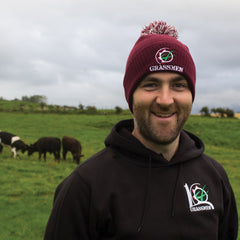 "GRASSMEN" maroon bobble hat on model